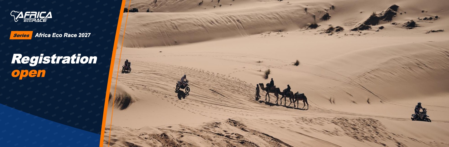 Rally motorcycles and a camel caravan in the sand dunes