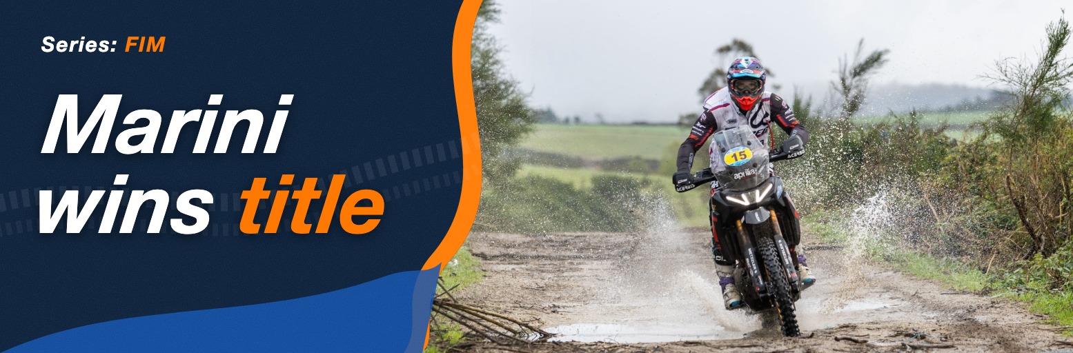 Rally rider on an Aprilia Tuareg Rally with race number 15 riding through a puddle on a gravel track