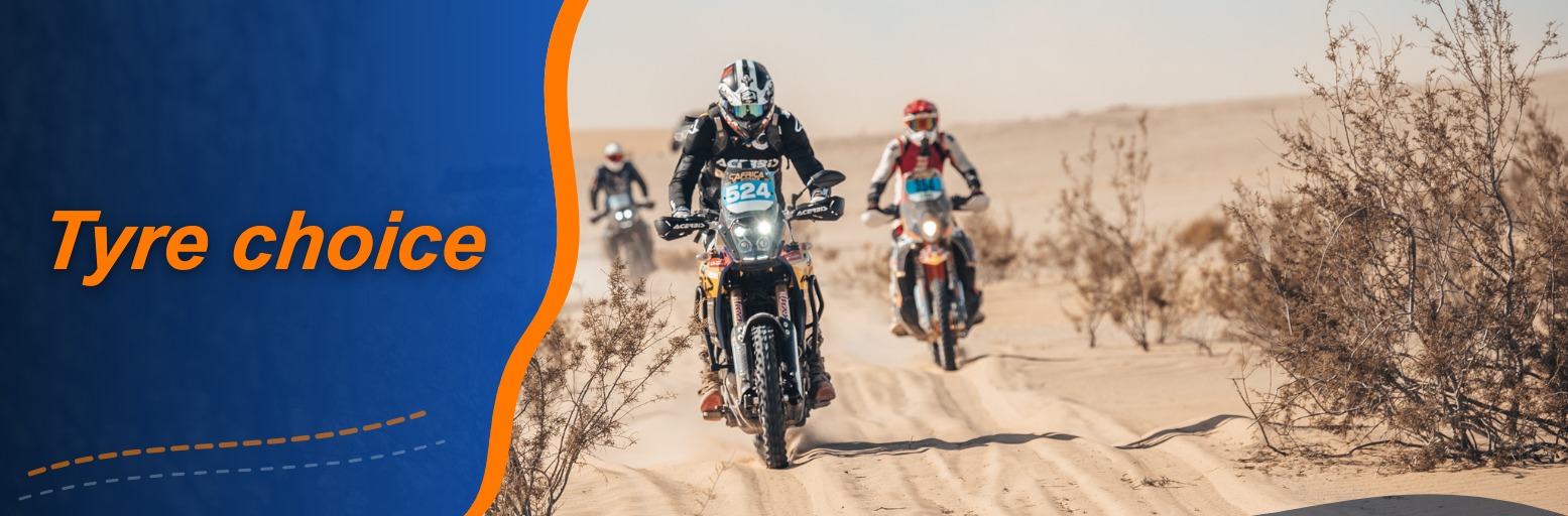 Rally rider on a Yamaha Ténéré 700 with race number 524 on a sandy track between dry shrubs