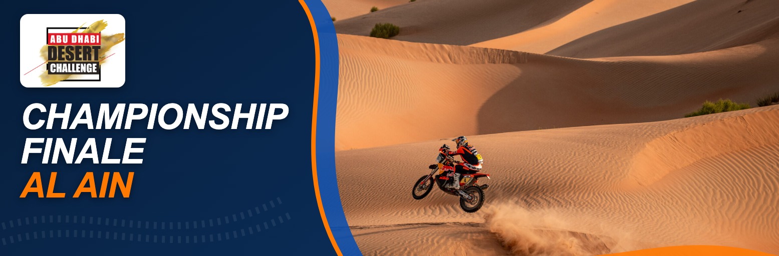 Rally motorcycle jumping over a sand dune in the Abu Dhabi desert